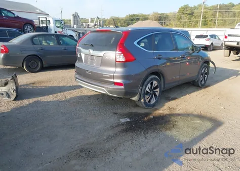 2016 Honda Cr-V Touring z USA, uszkodzony, nr VIN 5J6RM4H94GL137547